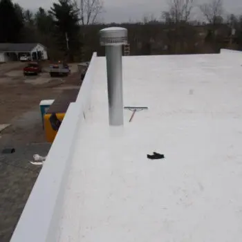 Flat white roof with chimney