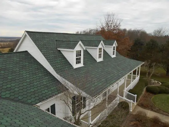 Green shingle roof house exterior