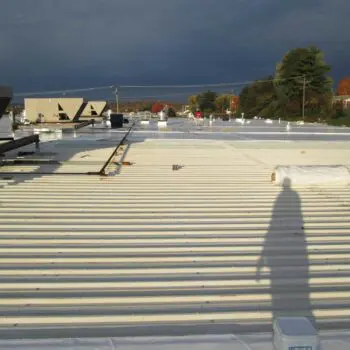 Flat metal roof under maintenance