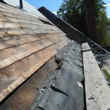 Damaged roof shingles and wood
