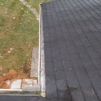 Asphalt shingle roof with gutter