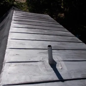 Metal roof with pipe vent