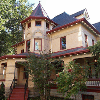Victorian home with detailed roofing
