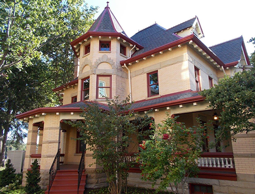Victorian home with detailed roofing