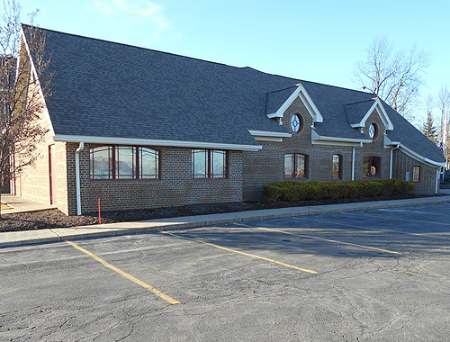 Brick building with shingle roof