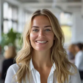 Smiling Woman In White Shirt At Modern Office During Day